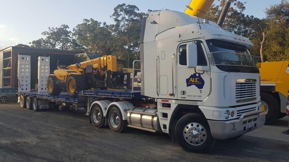 Truck Carrying Telehandler — Ulladulla Crane Hire in Milton, NSW