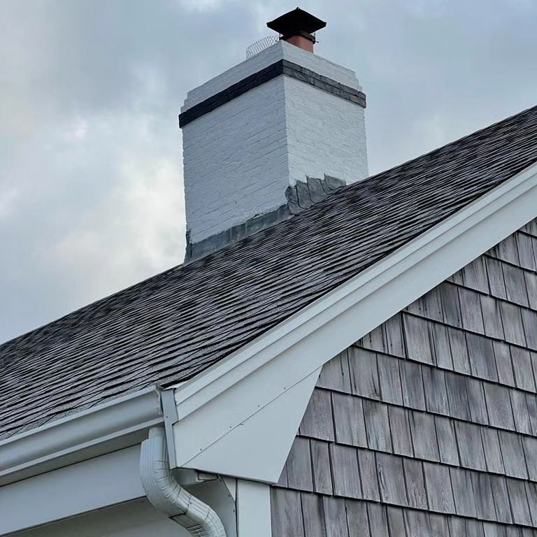 A chimney on top of a roof of a house