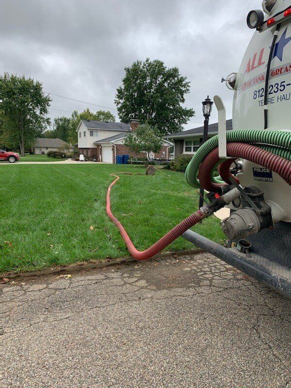 Truck Left Side With Hose In Septic | Terre Haute, IN | All Star Sanitation Inc.
