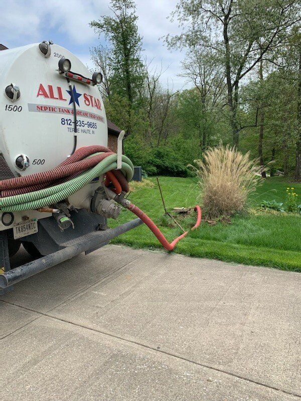 Truck Backside With Hose In Septic | Terre Haute, IN | All Star Sanitation Inc.