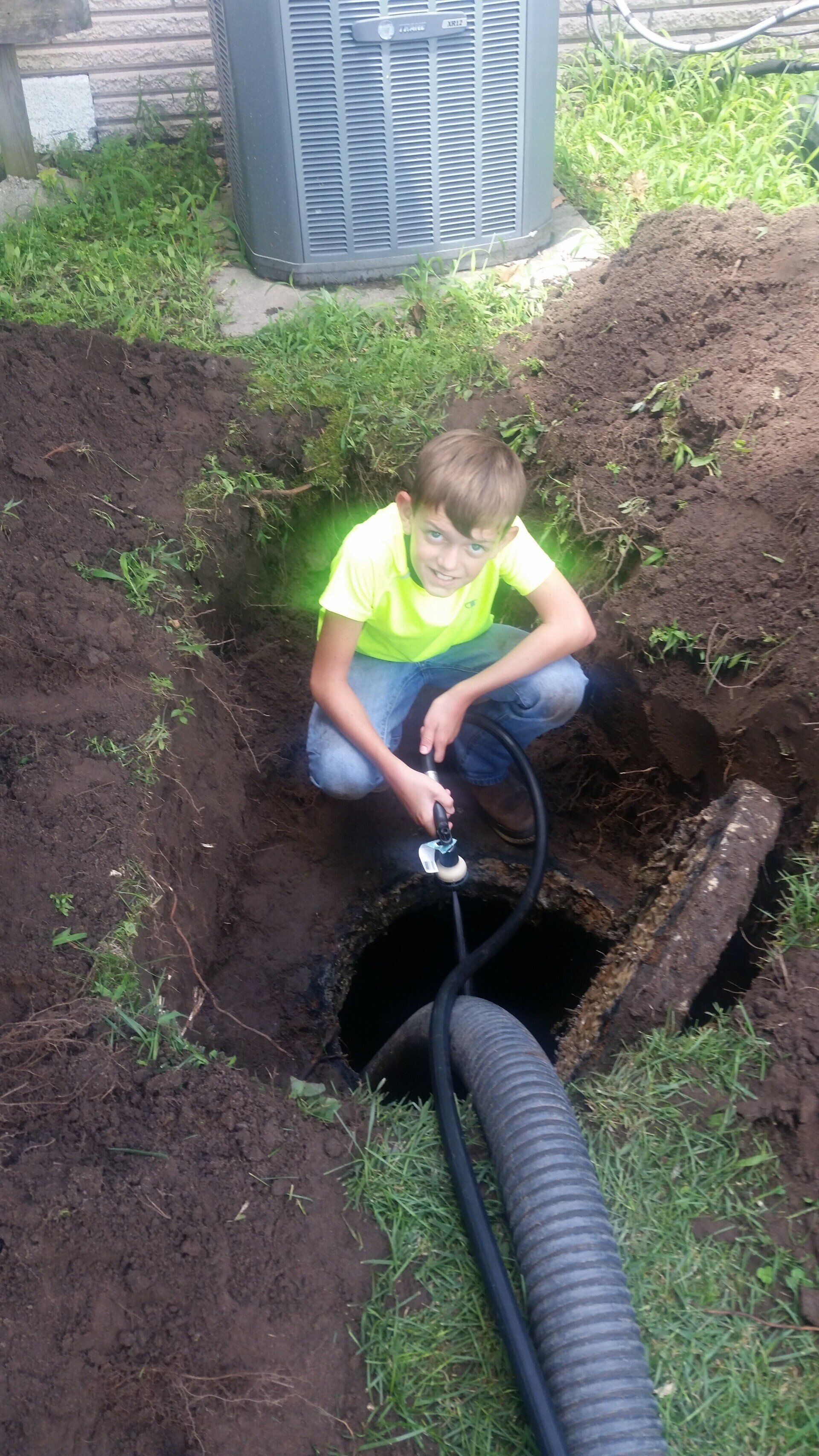 Kid Checking Hole | Terre Haute, IN | All Star Sanitation Inc.