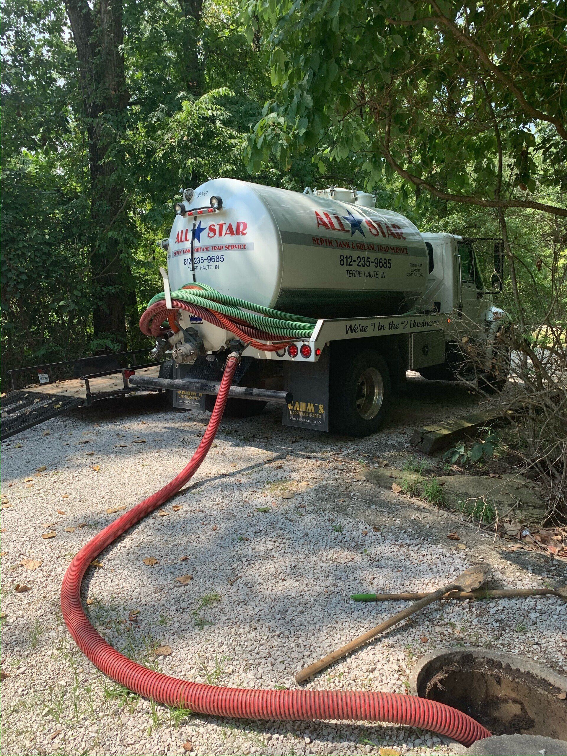 Truck With Hose | Terre Haute, IN | All Star Sanitation Inc.