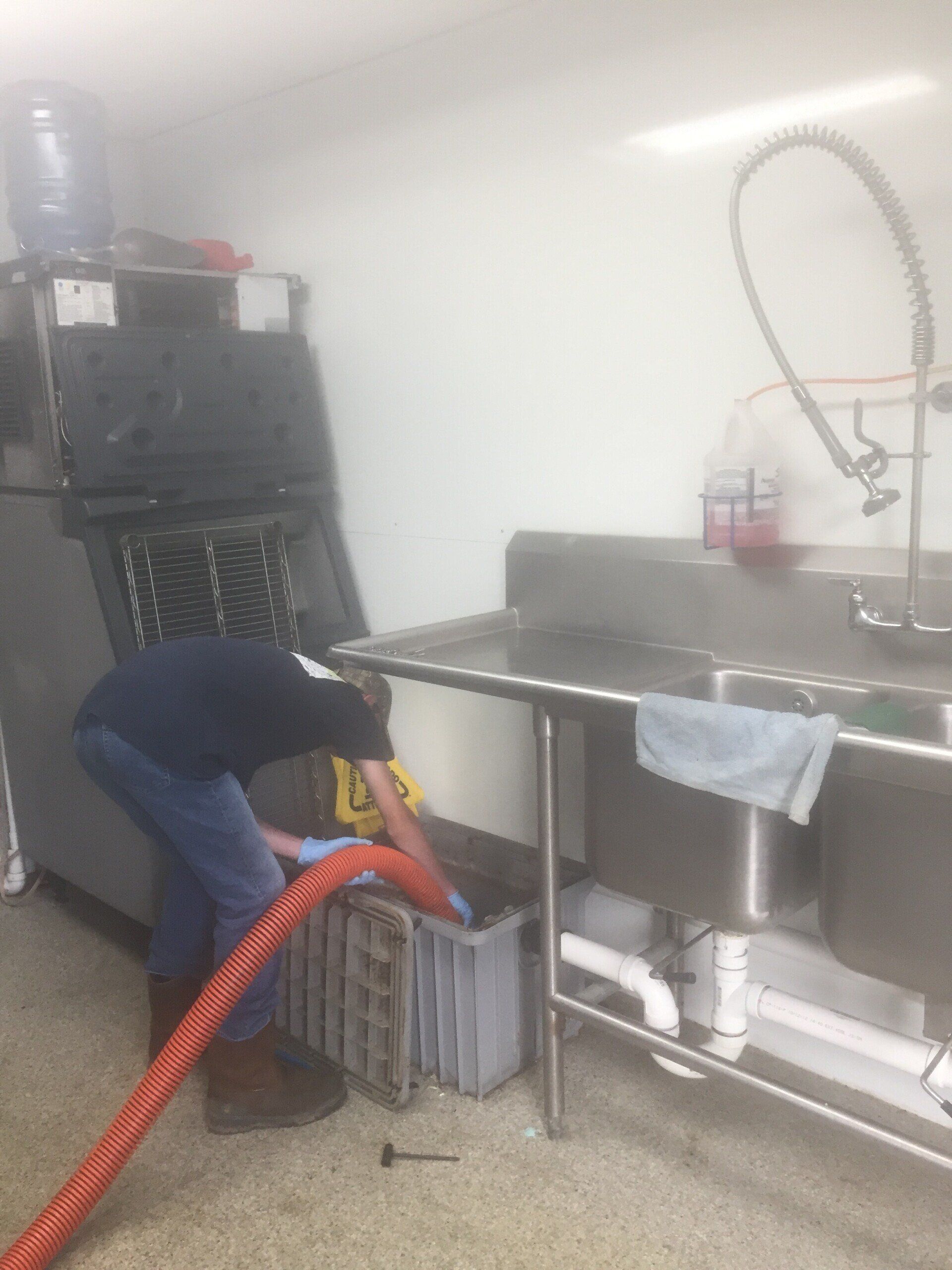 Man Putting Hose In Septic Machine | Terre Haute, IN | All Star Sanitation Inc.