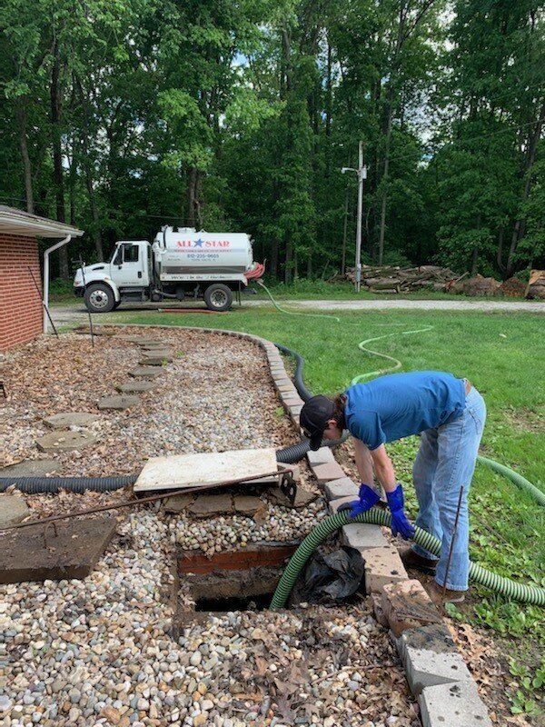 Man Cleaning Septic | Terre Haute, IN | All Star Sanitation Inc.