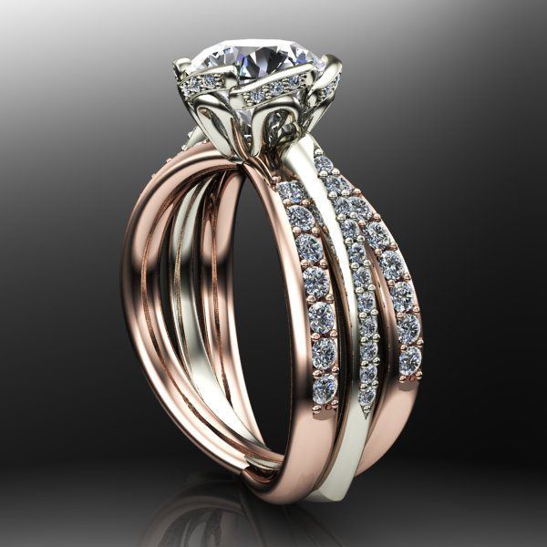 A close up of a diamond ring and wedding band