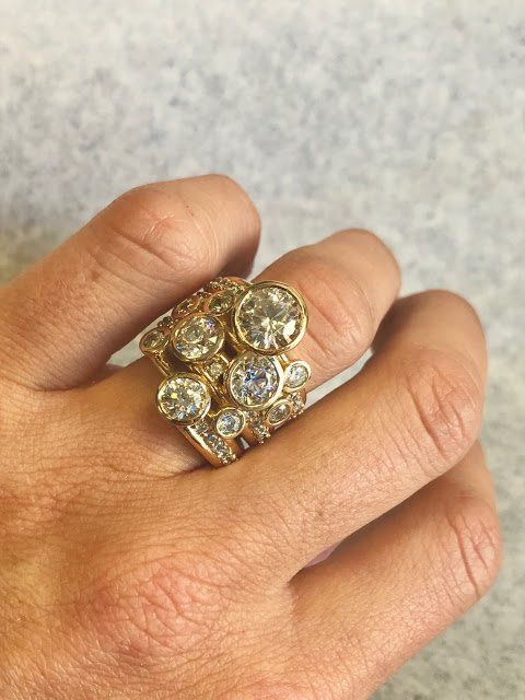 A close up of a person 's hand with a ring on it