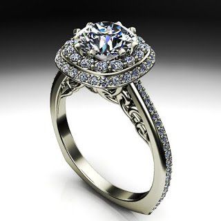 A white gold ring with a diamond in the center