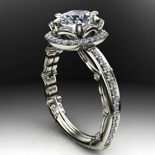 A white gold ring with a diamond in the center