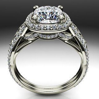 A white gold ring with a large diamond in the center