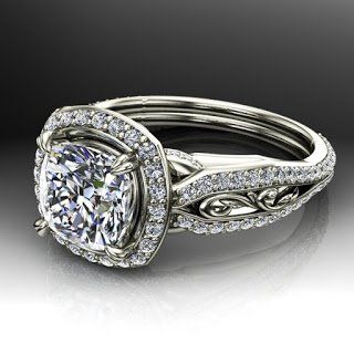 A white gold ring with a diamond in the center