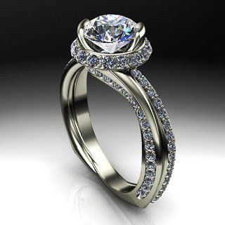 A white gold ring with a diamond in the center