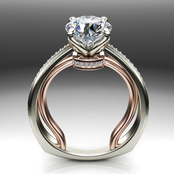 A white and rose gold ring with a diamond in the center