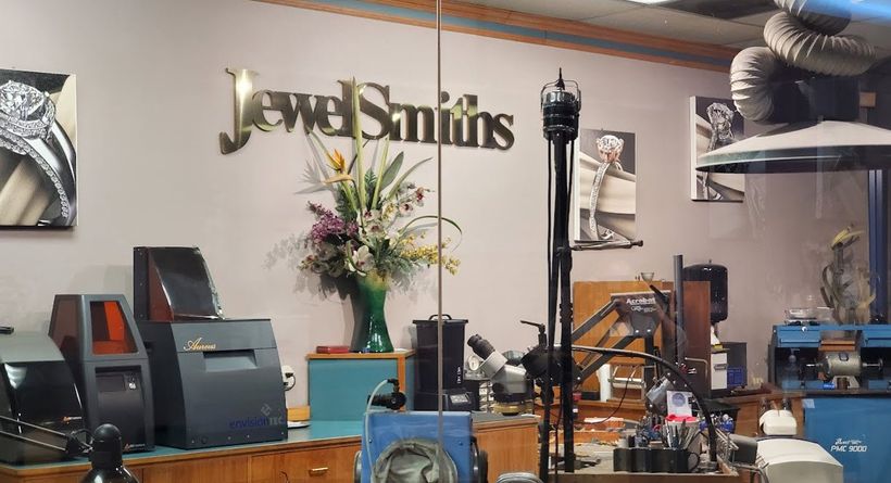 A jewelers shop with a sign on the wall that says jewel smiths