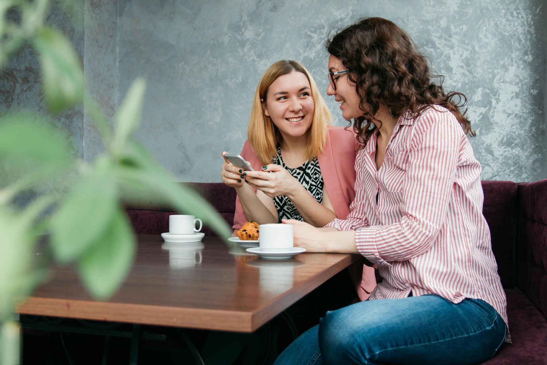 Workers exchange information as they drink coffee.