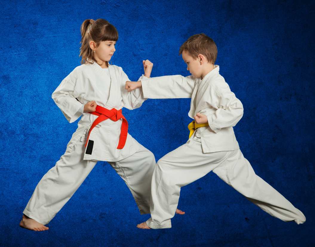 A boy and a girl are practicing karate on a blue background