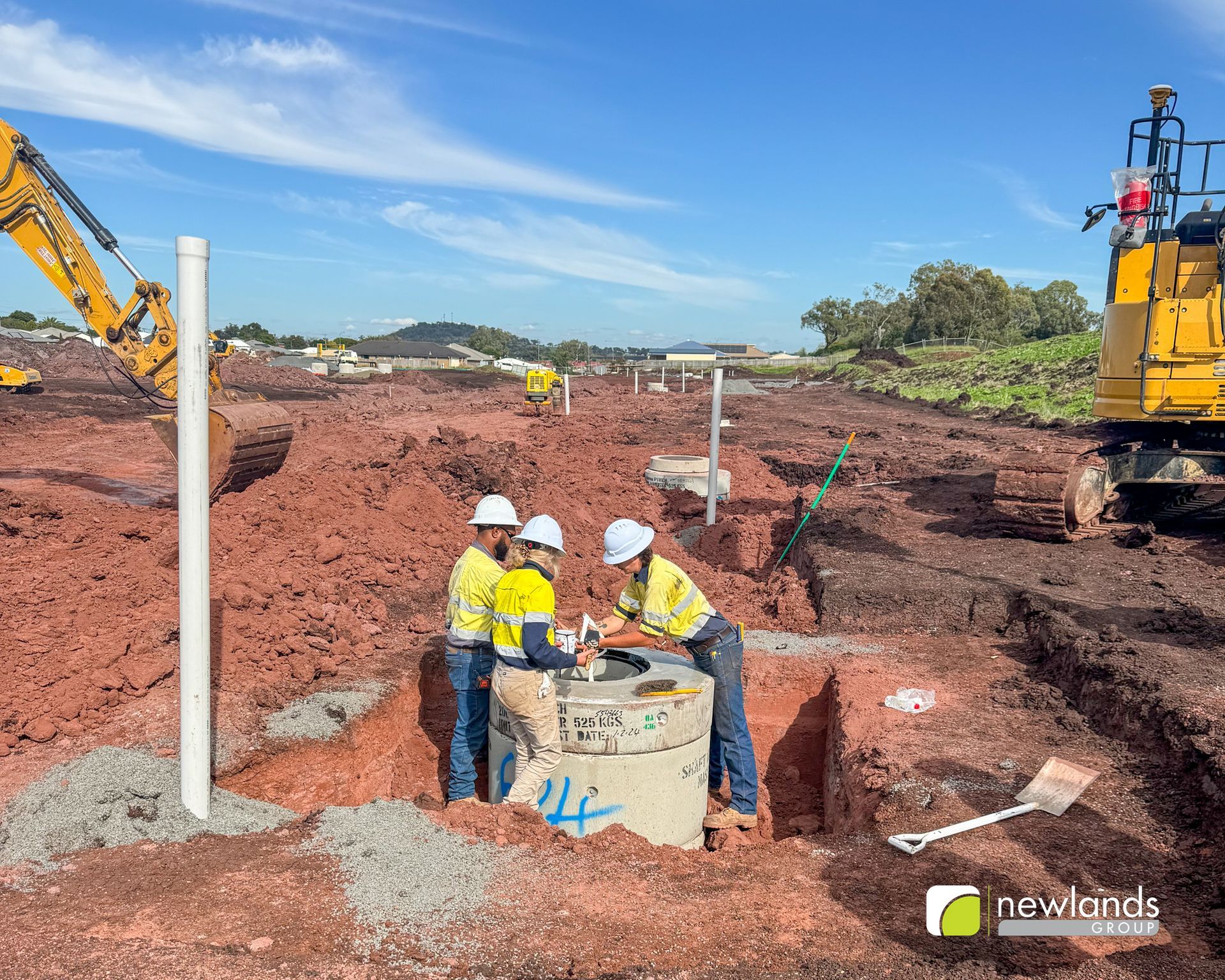 A group of construction workers are working on a construction site.