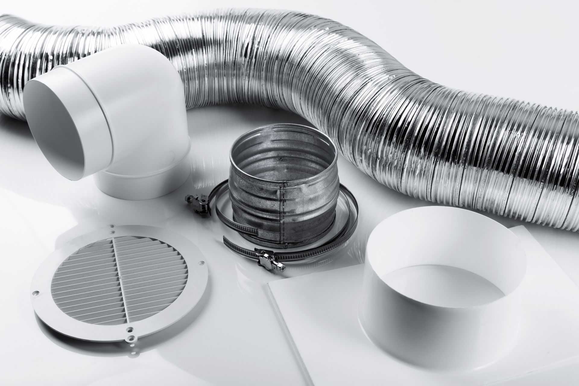 A bunch of different types of ducting are sitting on a table.