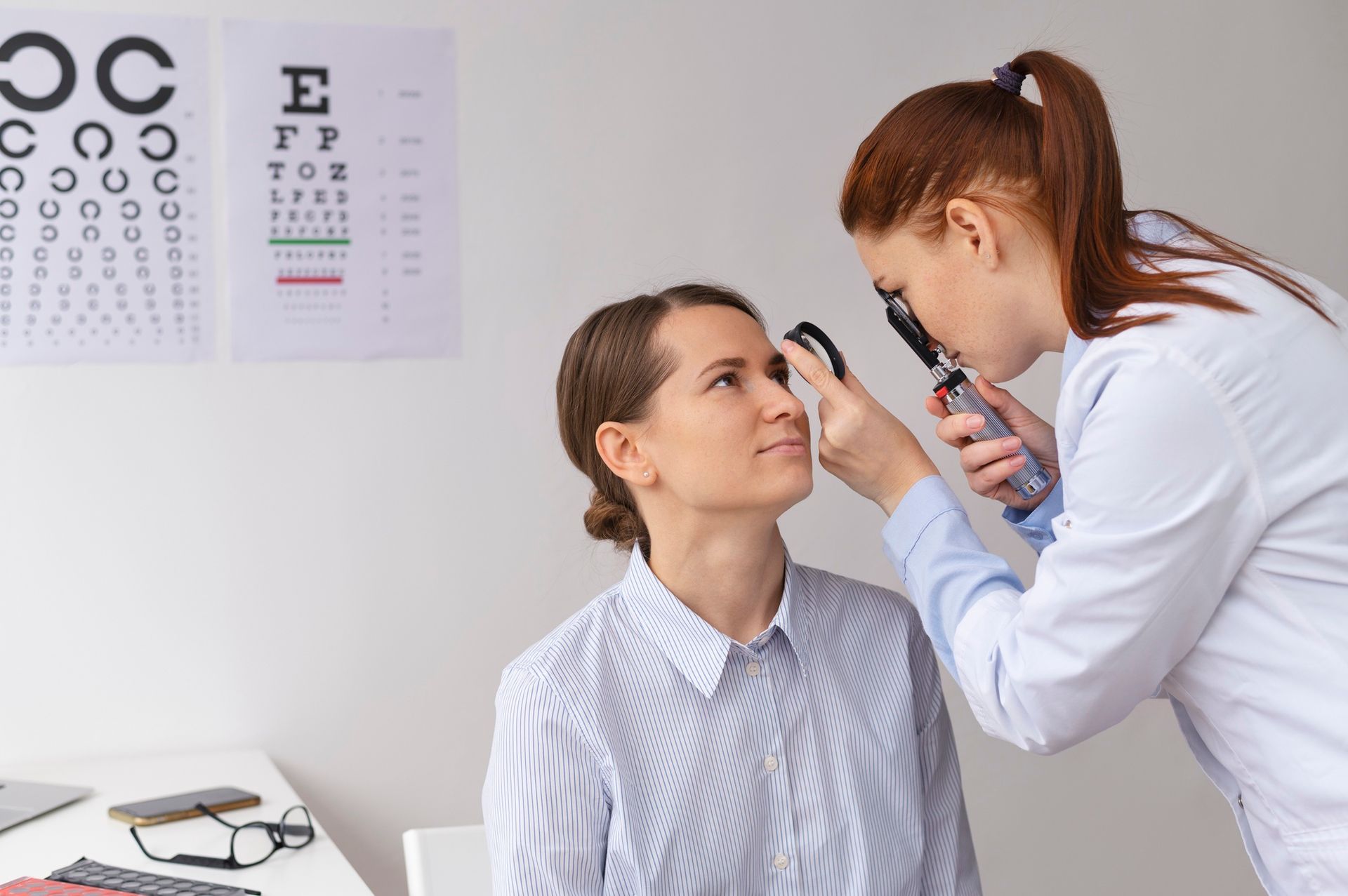 A woman is getting her eyes examined by an ophthalmologist.