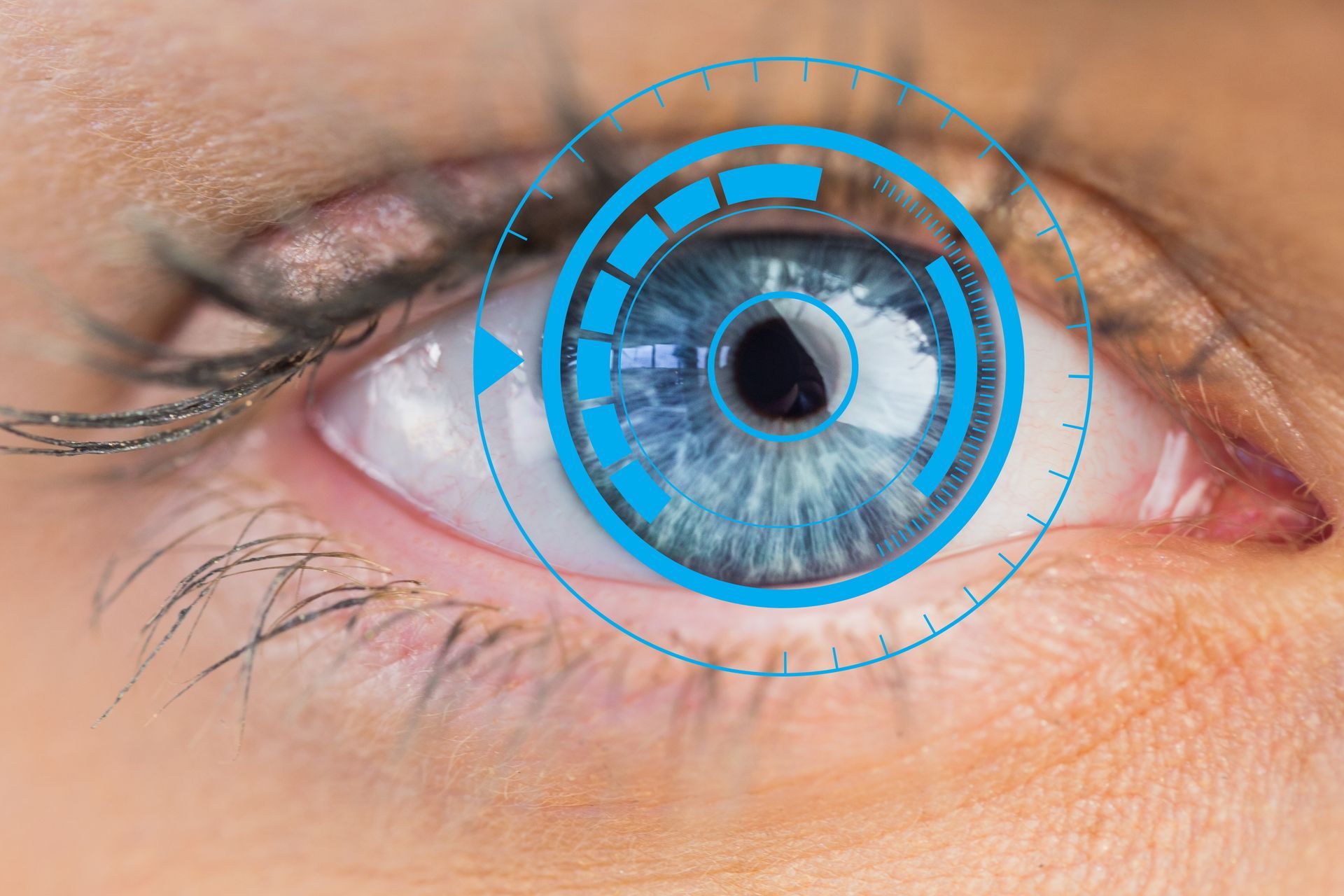 A close up of a woman 's eye with a blue circle around it.