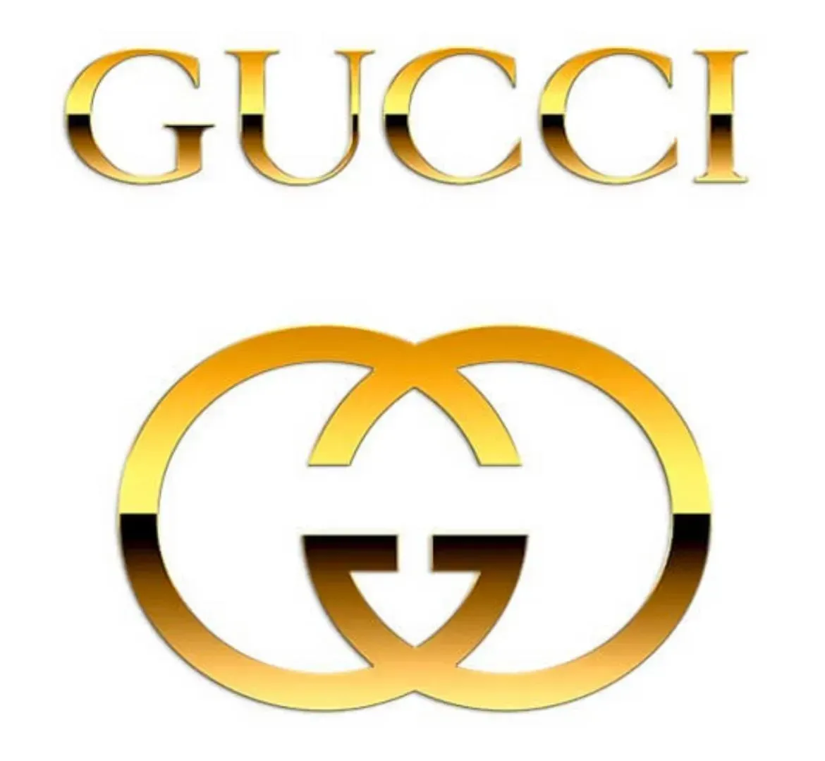 A gold gucci logo on a white background