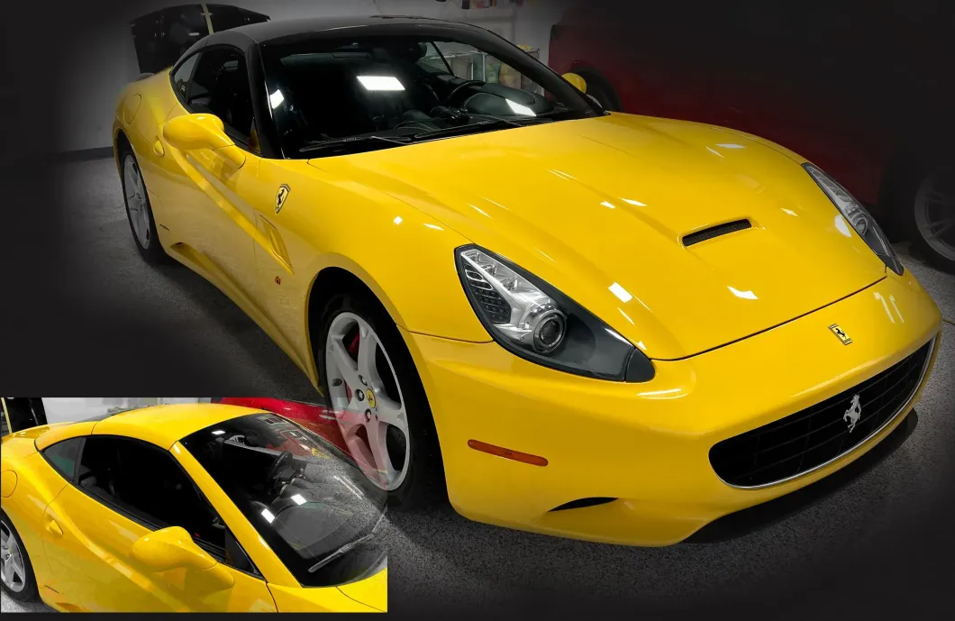 A yellow ferrari sports car is parked in a garage