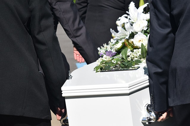 Pall Bearers Carrying Casket at Funeral Service