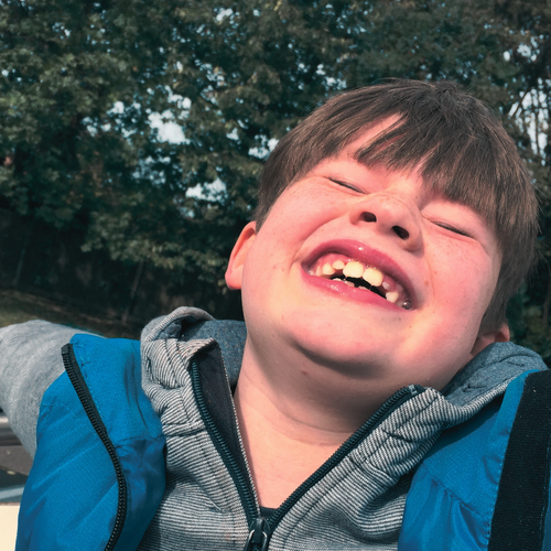 smiling Hope House resident with profound disabilities in Liberty TX