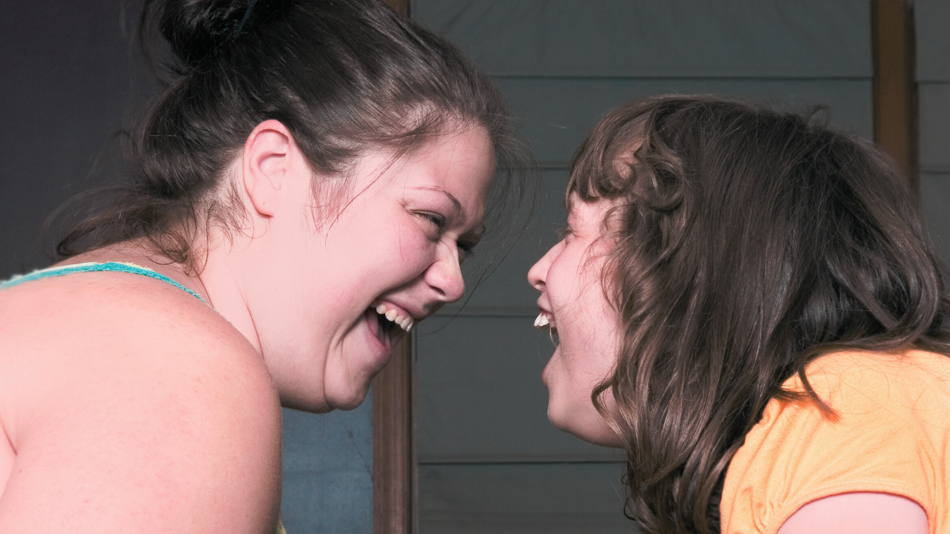 Resident with profound disabilities smiling alongside a caregiver at Hope House in Liberty Hill, TX