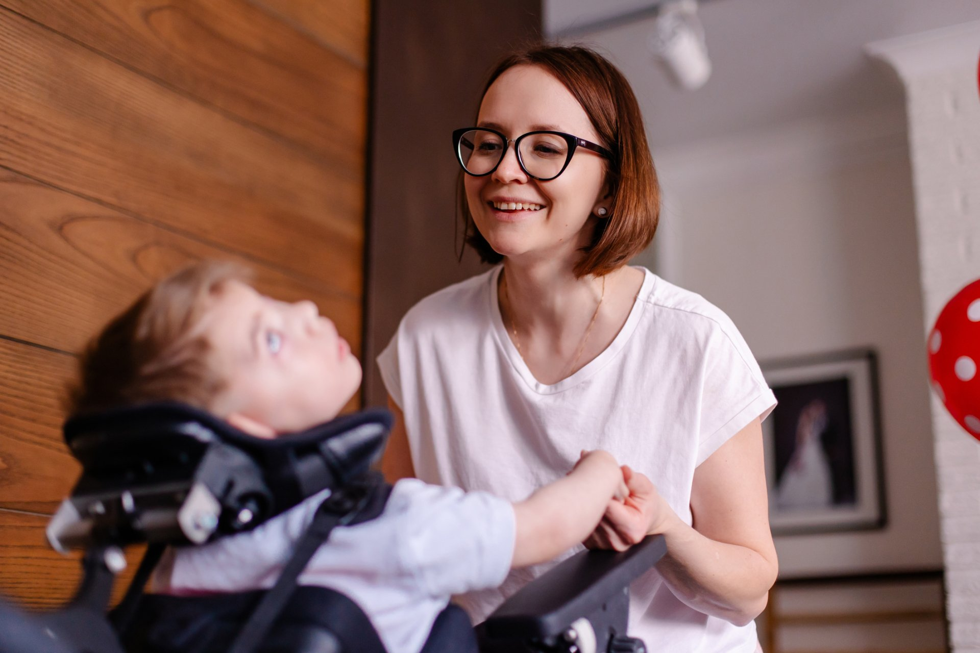 Caregiver guiding a young resident through a therapy session at Hope House in Liberty Hill, Texas