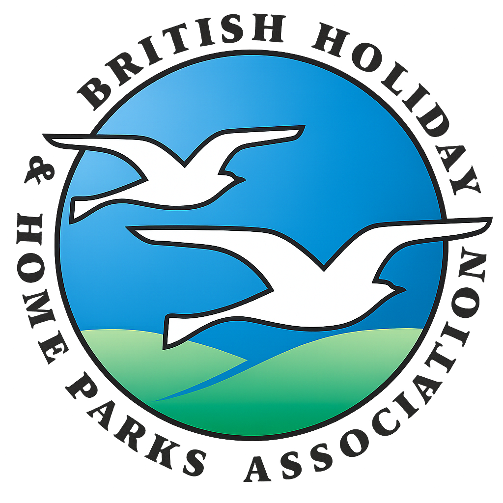 British Holiday & Home Parks Association logo with white birds in front of a blue and green background.