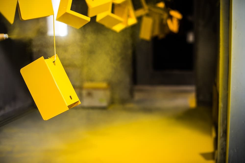 Yellow Metal Boxes In The Process Of Powder Coating — Aliweld Fabrications In Caloundra West, QLD