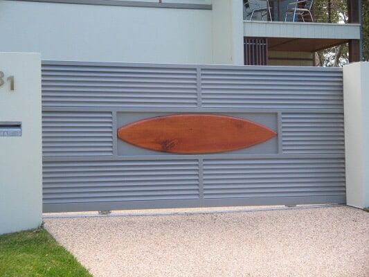 A Close Up Of A Grey Sliding Gate — Aliweld Fabrications In Kawana, QLD