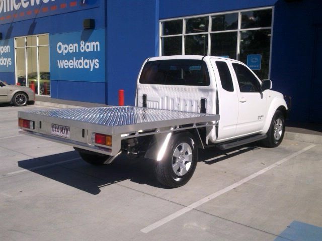 A White Truck is Parked in Front of a Building That Says Open 8am Weekdays — Aliweld Fabrications In Caloundra, QLD