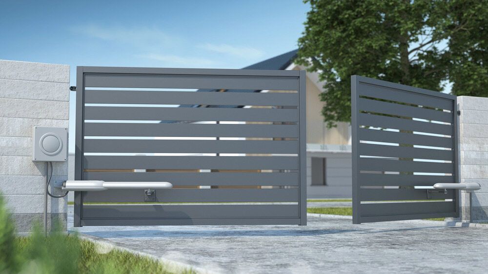 A Gray Gate With A Motor Attached To It Is Open In Front Of A House — Aliweld Fabrications In Caloundra, QLD