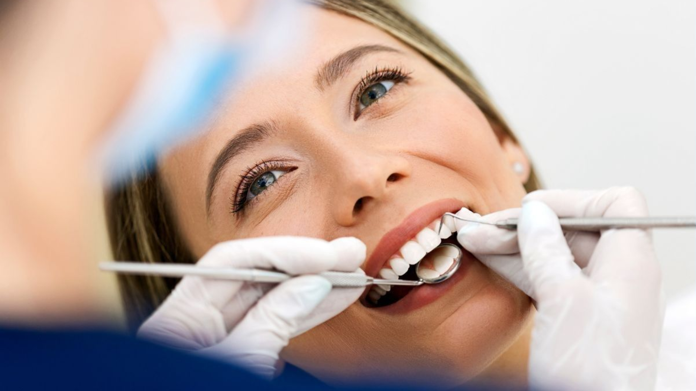 A patient receives a comprehensive dental exam 