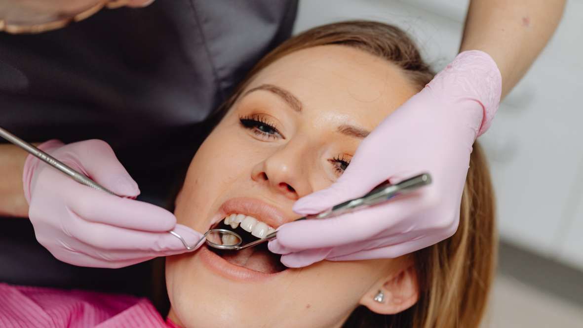 A woman get her Teeth inspected before a regular cleaning in NYC