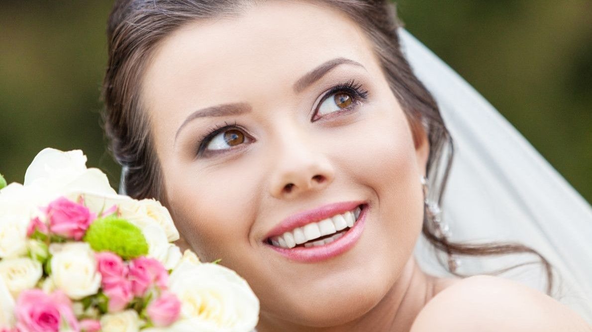 A bride with a beaturiful smile white teeth 