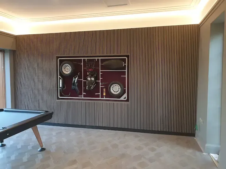 There is a pool table in the middle of the room.