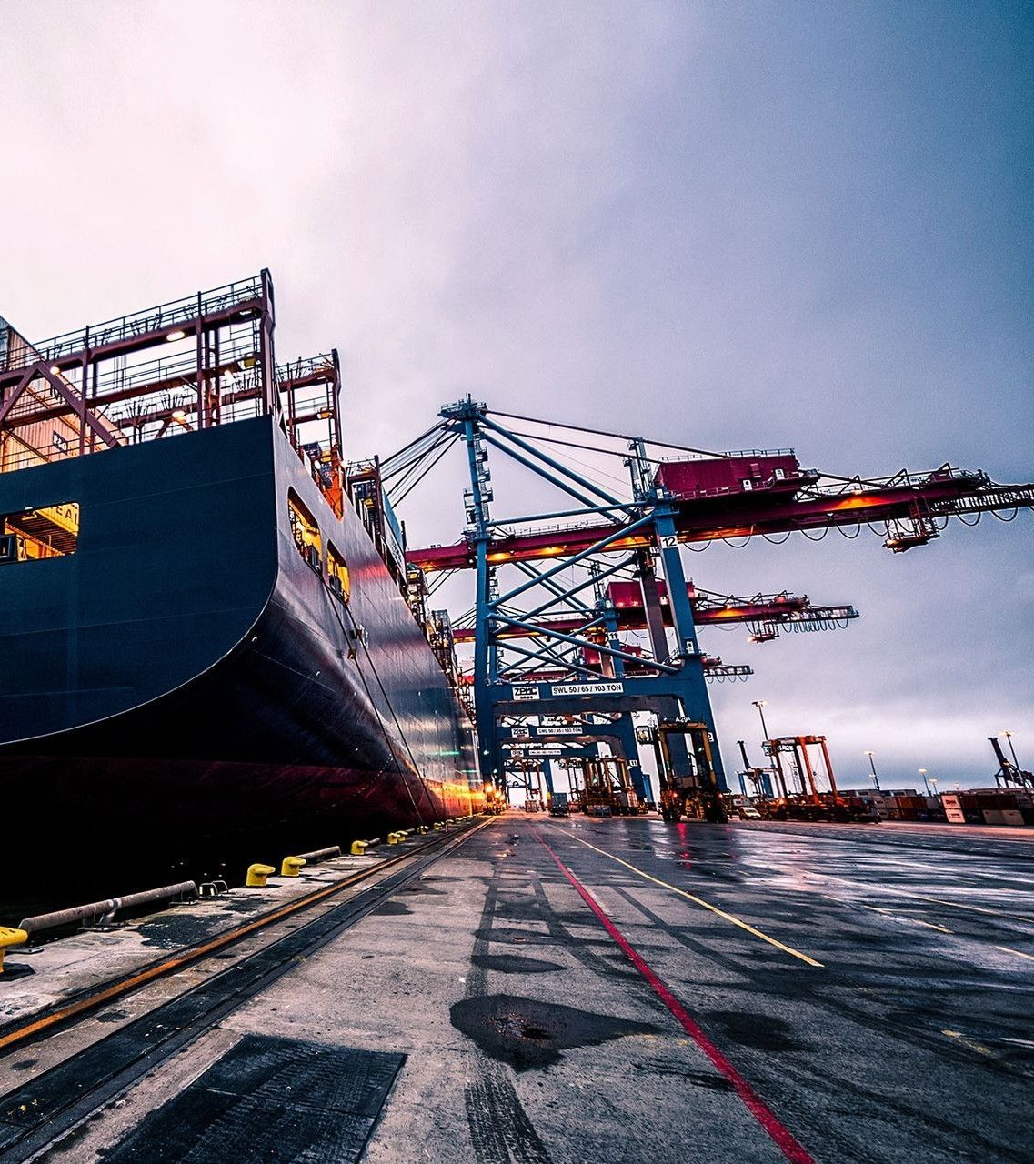 A group of people are looking at a computer screen in an office.