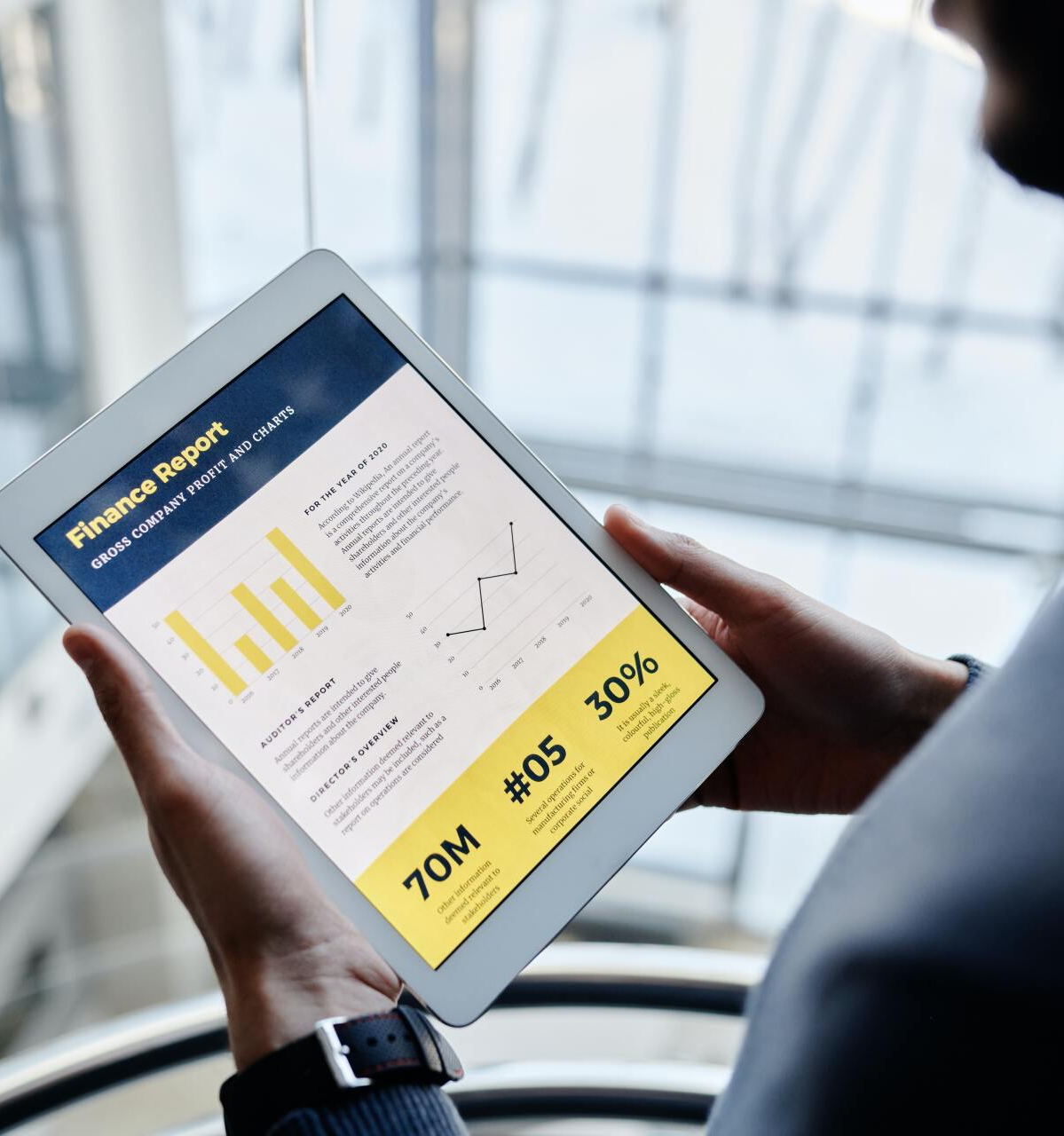 A group of people are looking at a computer screen in an office.