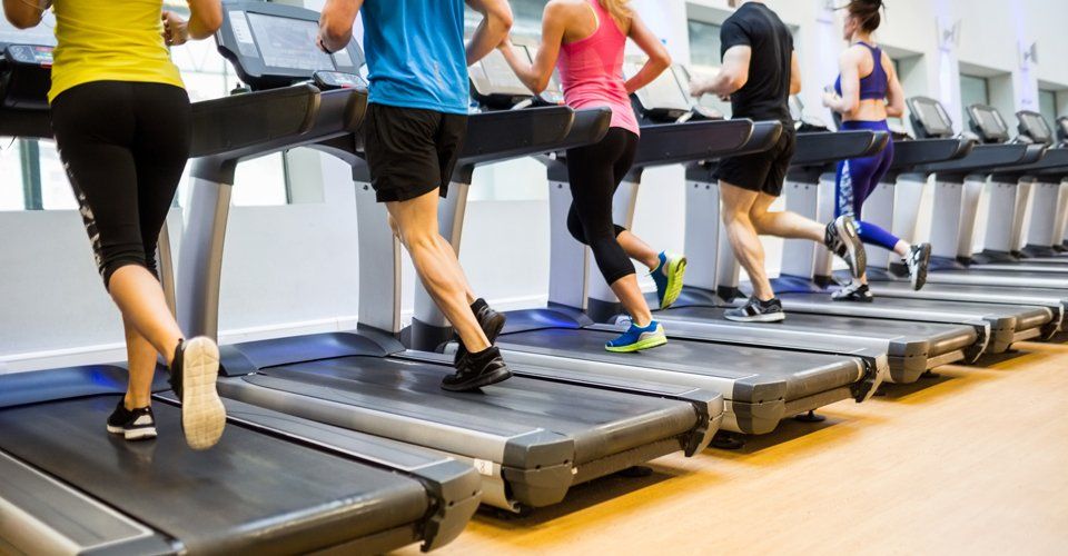 People running on treadmill to keep fit 