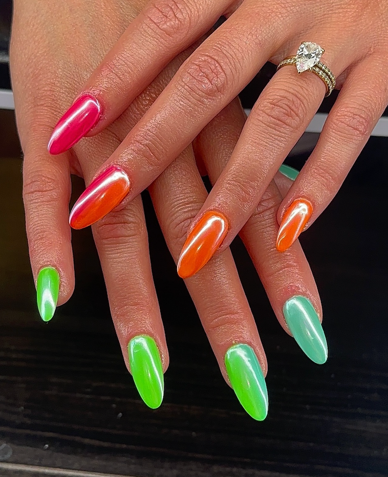 A close up of a woman 's nails with a ring on her finger