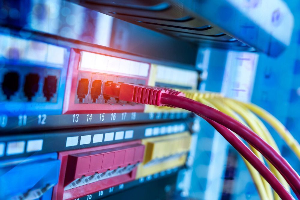 A Bunch of Wires are Connected to a Server in a Data Center — Bangalow Electrical in Bangalow, NSW