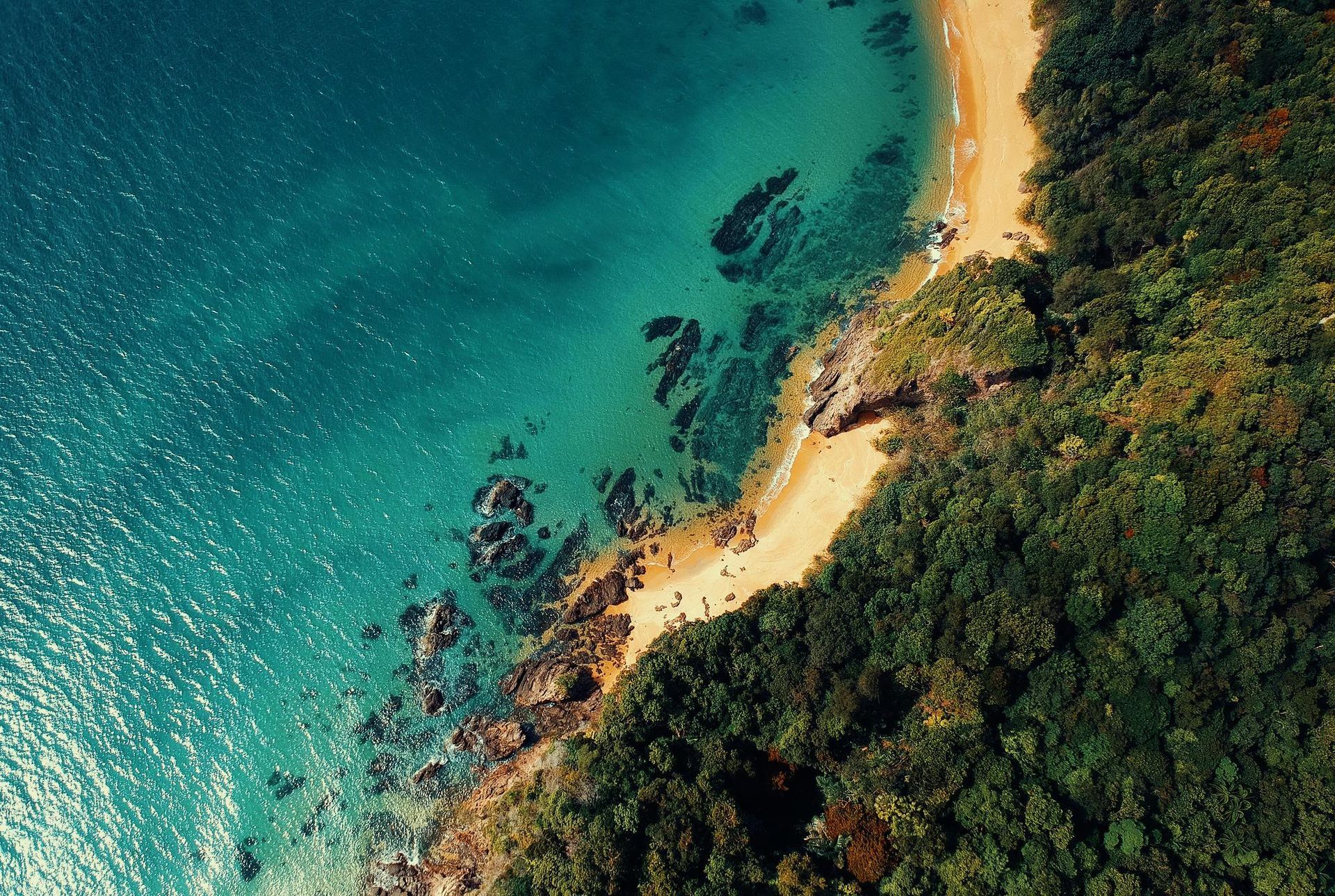 A View of a Beach From a Pier With a White Railing — Bangalow Electrical in Ocean Shores, NSW