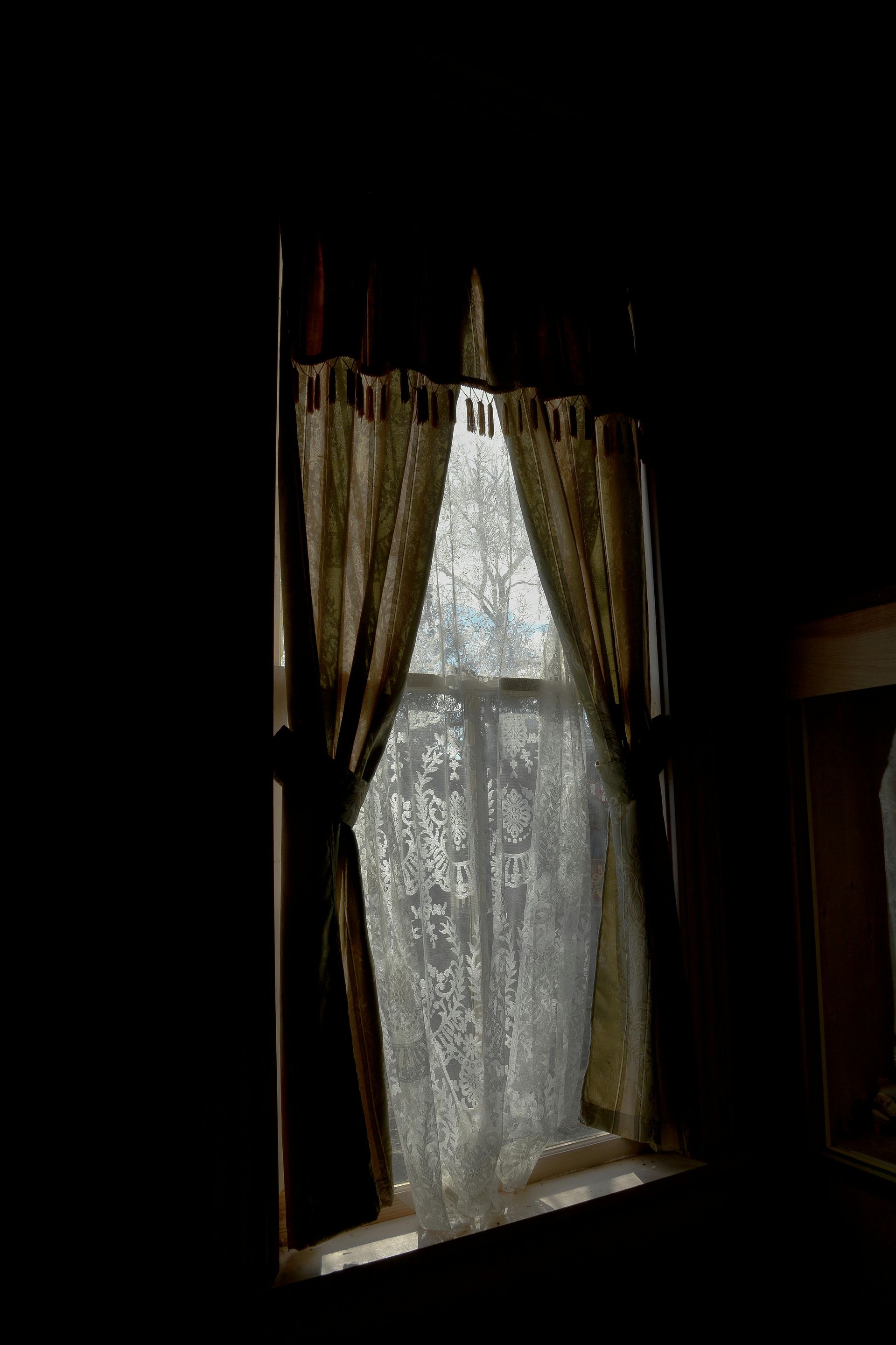 A playground in front of a building with a lot of buildings in the background.