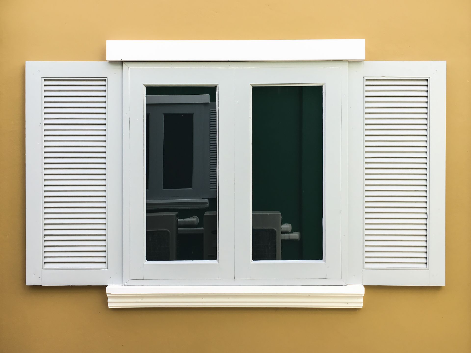A little girl is running through a bouncy house.
