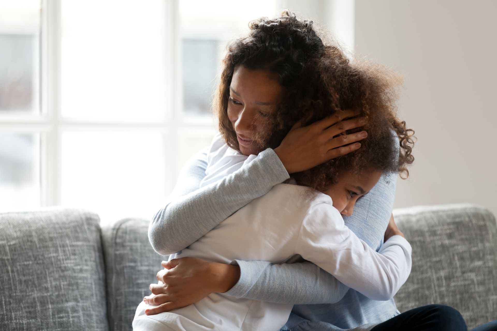 Mother Holding Child after Therapy Session in San Clemente, CA