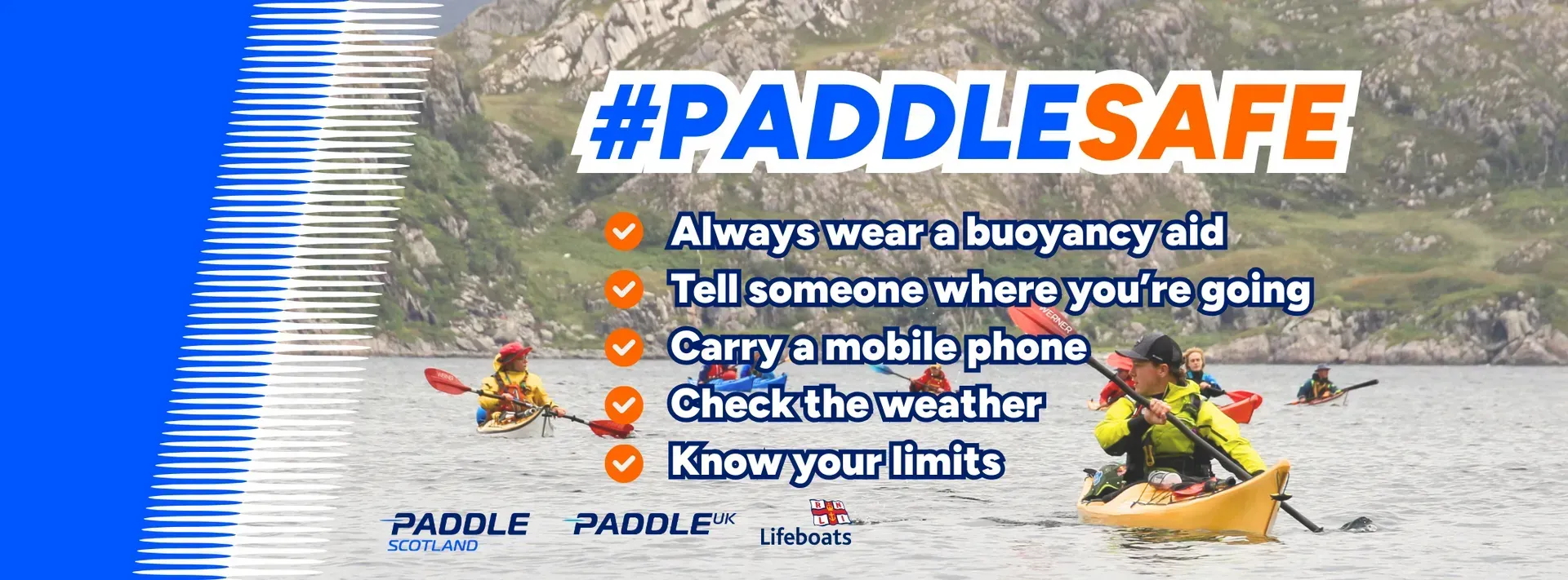 A person is paddling a kayak on a lake while wearing a buoyancy aid
