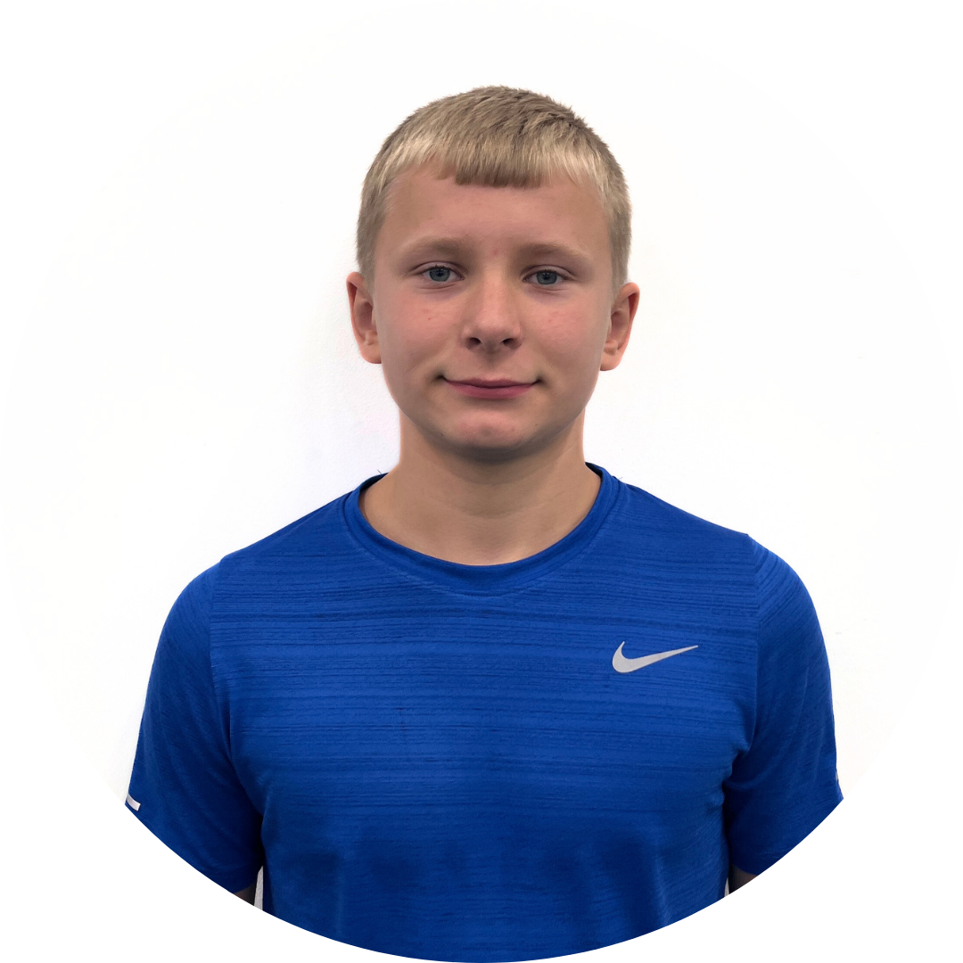 A young person with light hair and a blue shirt smiles, centered against a white background.
