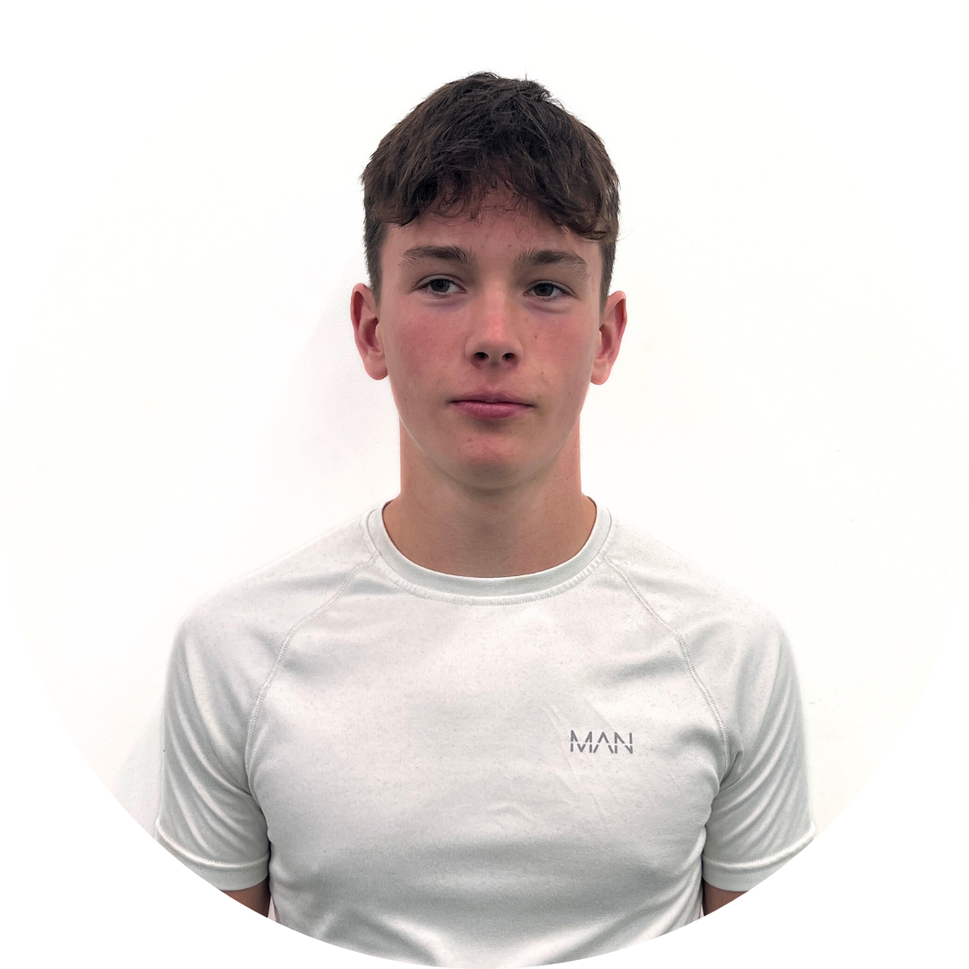 Young man in a white shirt with dark hair and neutral expression against a white backdrop.
